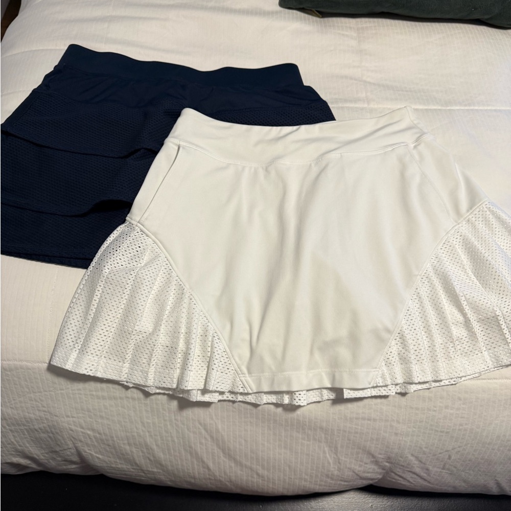 Under Armour golf Mini Skirts in Navy and White